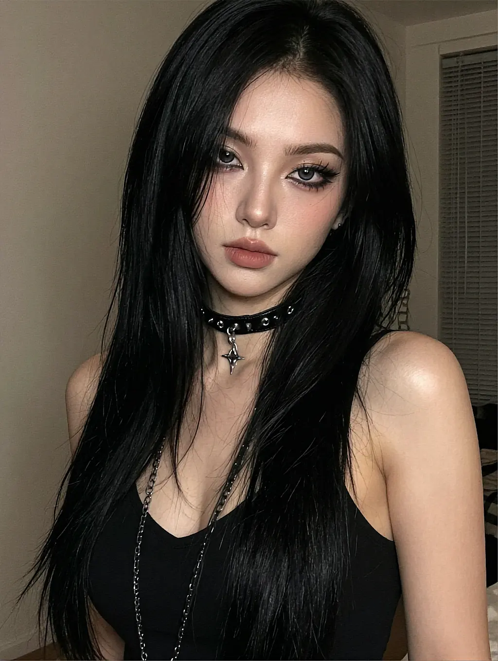 Fictional AI companion with long black hair and a star-charm choker in a dim bedroom